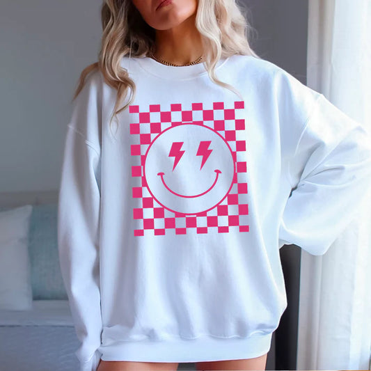 Pink Checkered Smiles: Elevate Your Look with our Smiley Face Graphic Tee
